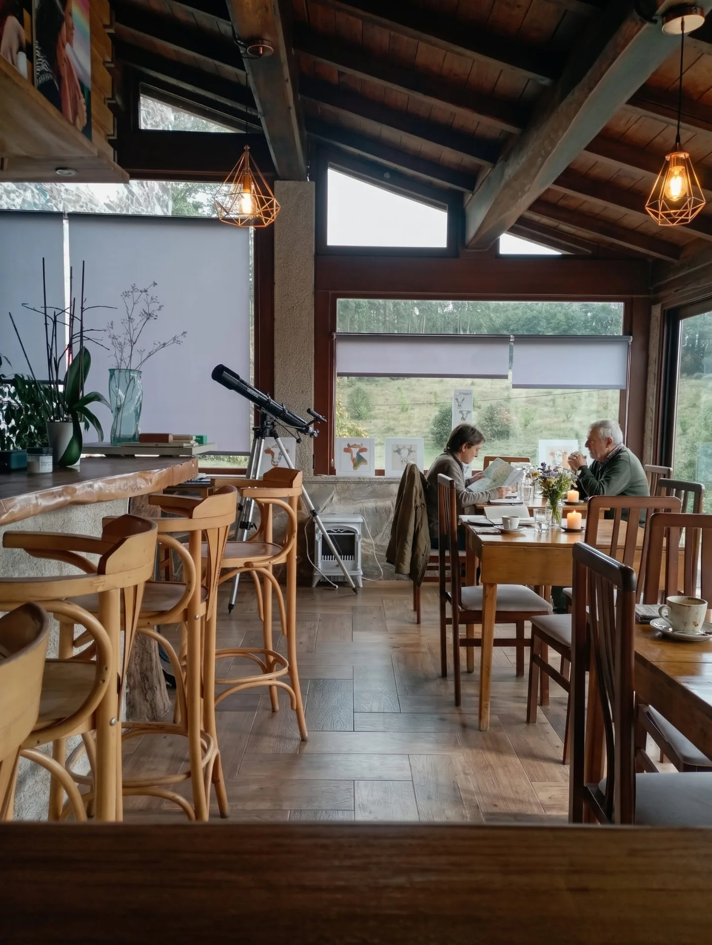 Glazed dining room at As Casiñas with guests