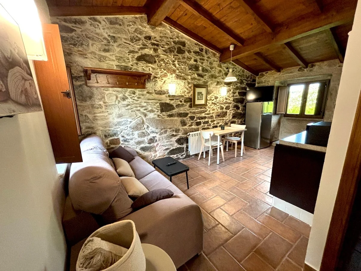 Stone living room with sofas and fireplace