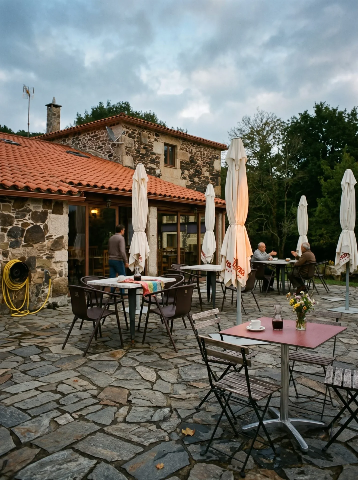 Outdoor terrace at As Casiñas among stone walls